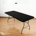 Black stretch tabletop cover on folding table