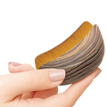 Brown curved face brush held in hand