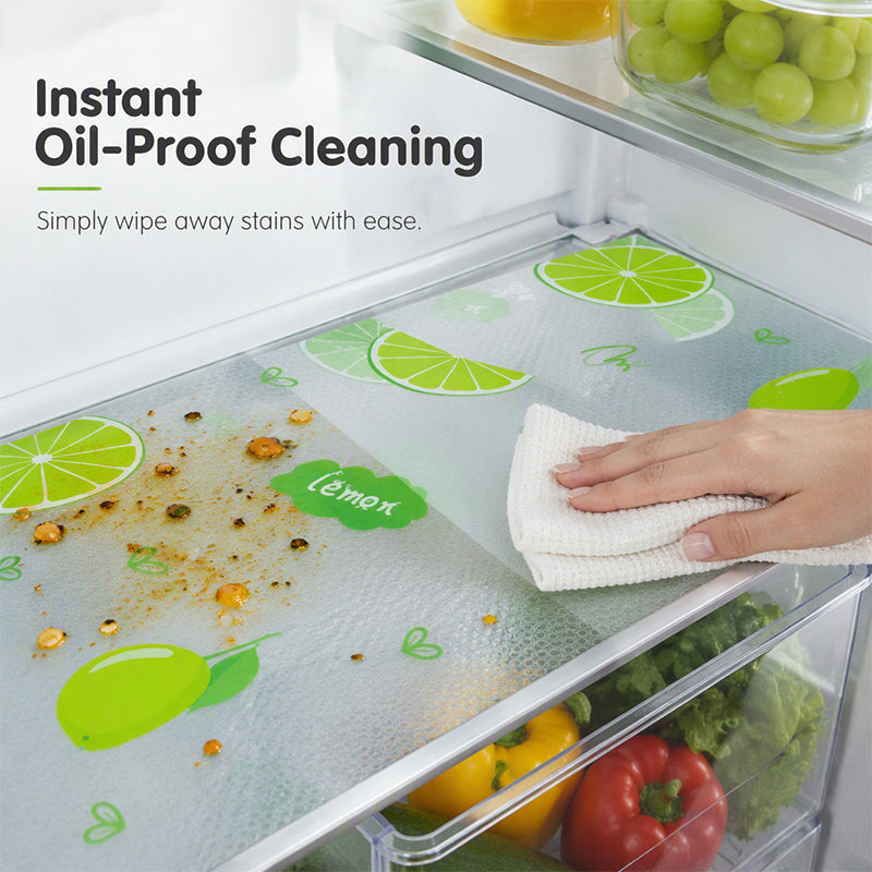 Lime-pattern refrigerator mat beneath food containers
