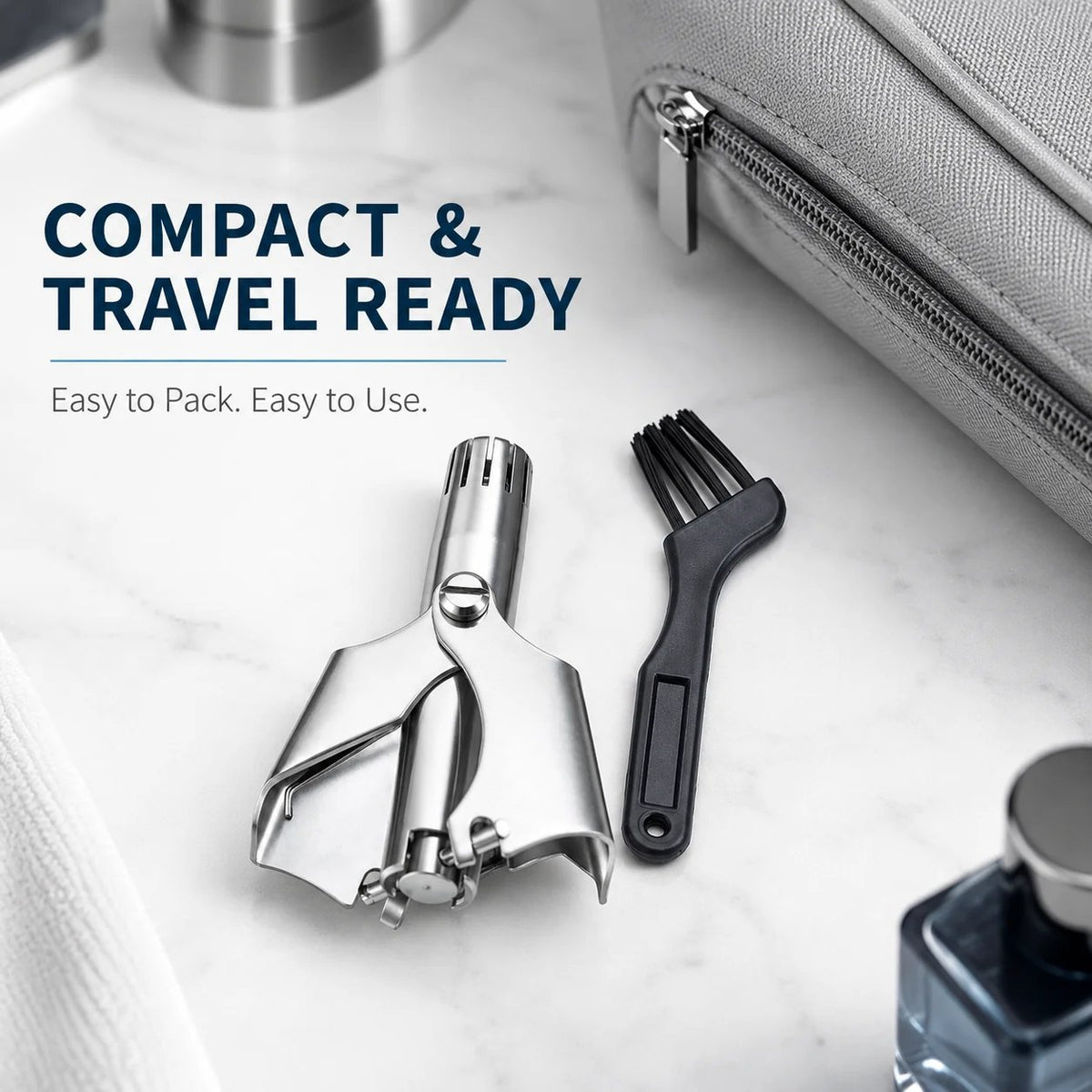 Compact manual grooming tool near a travel bag