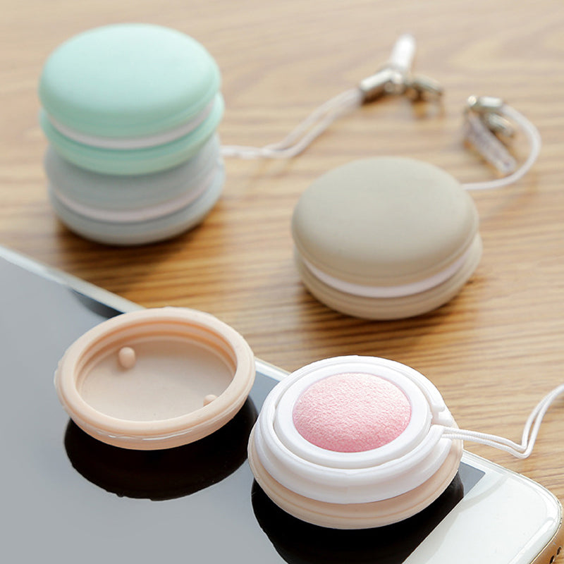 Compact cleaning brush used on a phone screen