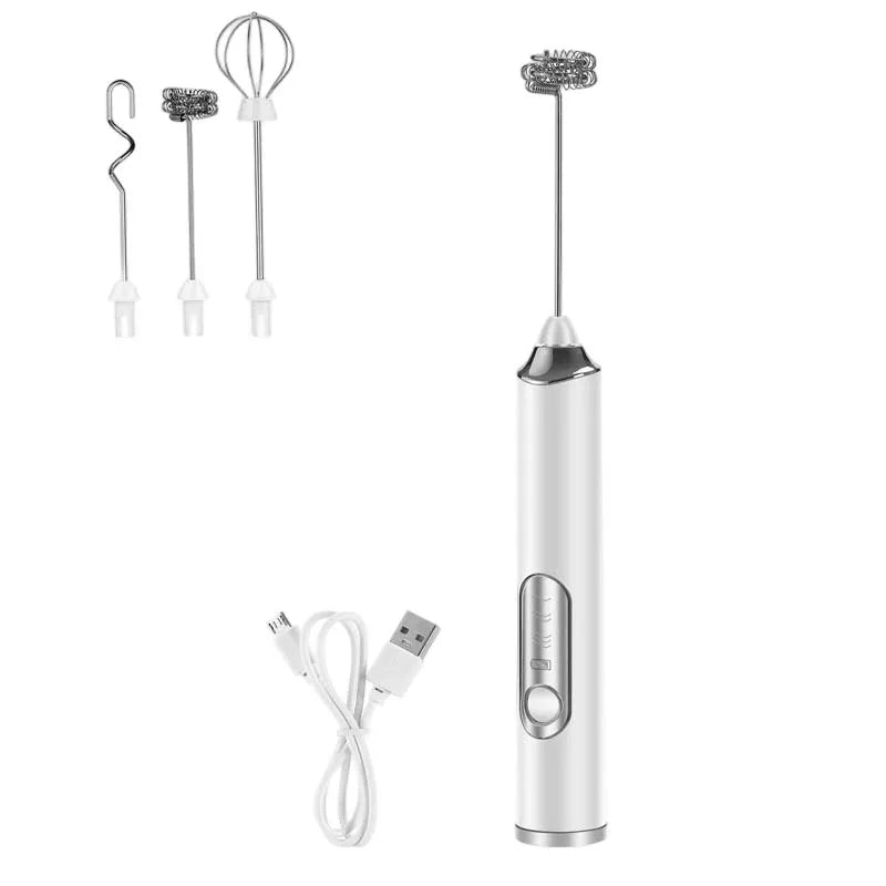 White handheld electric milk frother with interchangeable heads and USB cable